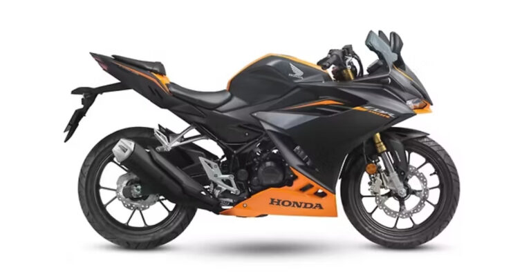 The front assembly of the bike where the 2026 Honda CBR150R features gold upside-down forks and aggressive dual LED headlights.