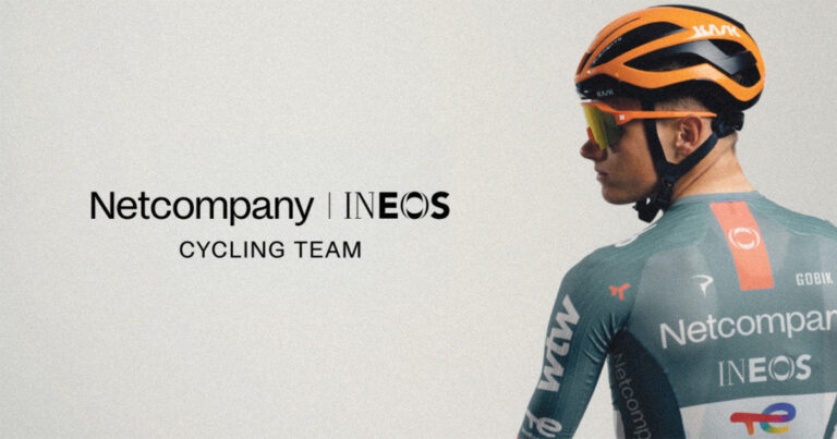 Team cars displaying branding for the new Ineos cycling AI partnership.