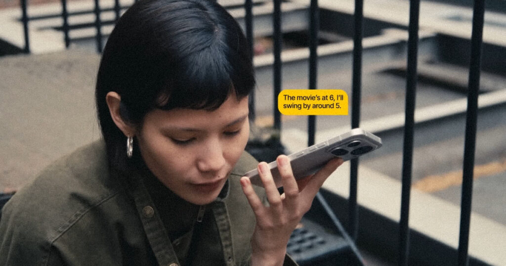 A user activating the Nothing Essential Voice feature on their smartphone during a professional meeting